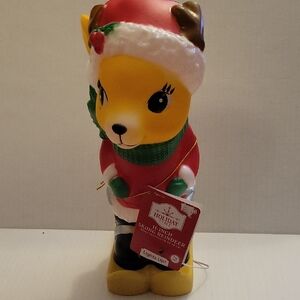 Holiday time 11 inch skiing reindeer blow mold,  lights up.